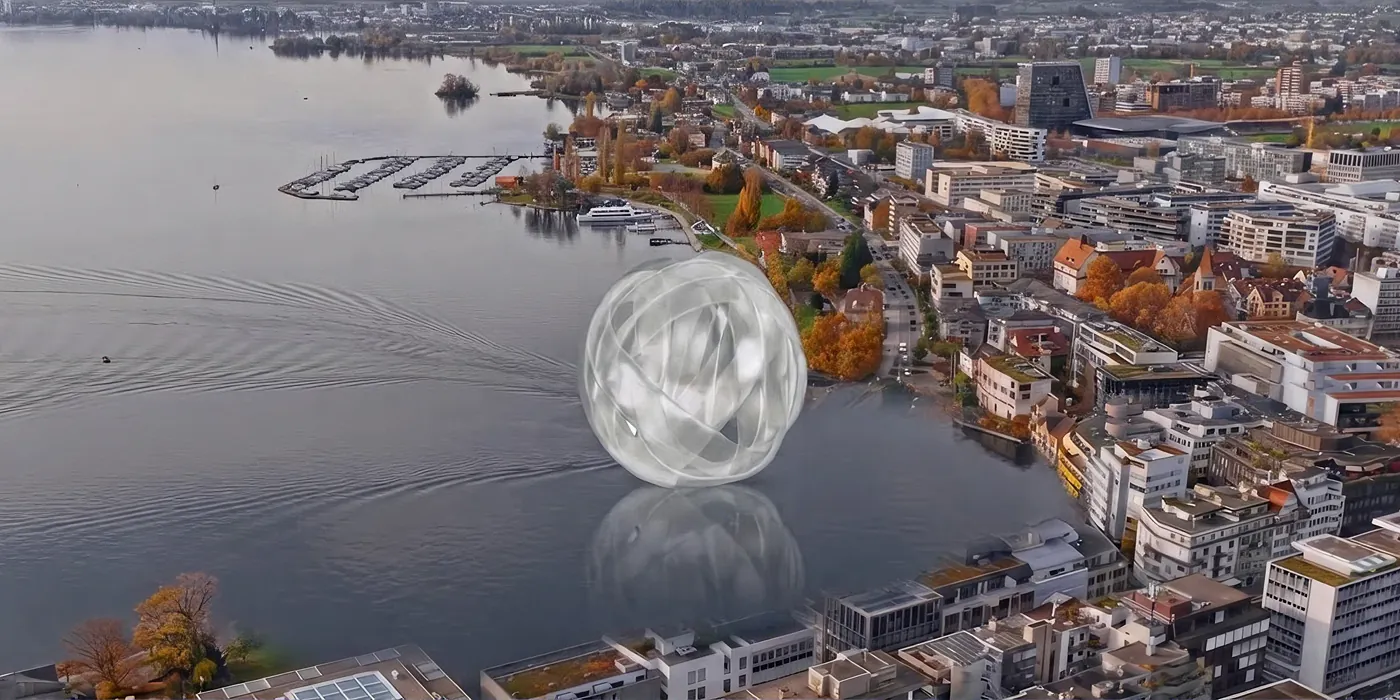 The Ribbon Sphere Glass sculpture hovering above Lake Zug